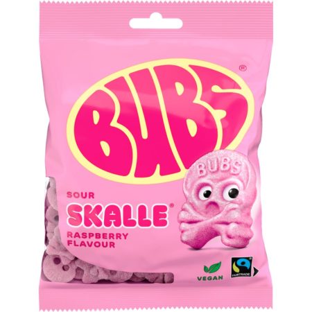 A pink bag of BUBS sour skull-shaped foam candies labeled ‘Skalle Raspberry Flavour,’ featuring a cartoon pink skull character on the front and icons indicating vegan and Fairtrade certification.
